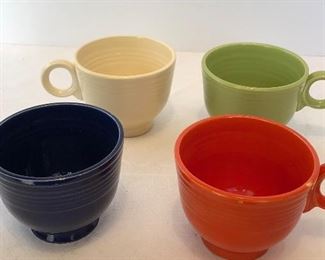 Lot #19 set of four fiesta cups, red cup has defect to rim, $16