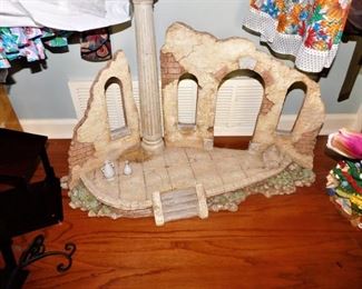 Very interesting piece. appears to be a Roman ruin piece, hand made, for decor of your choosing. Cool! Not small!
