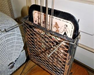 This is also interesting. This is a cheap metal tray with nice graphics. Includes 4 rotissory wire handled frames for cooking over a fire. The whole set is intact and complete. Cool!