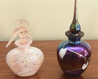 10. Two Glass perfume bottles $10
with foil “Made in Taiwan” tags. Pink with hummingbird, dark iridescent with white hearts. 5” and 6” tall respectively. 