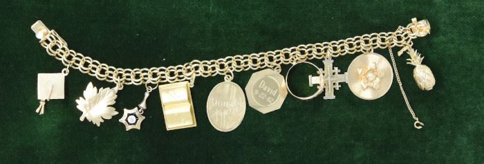 Jewelry 6: 14k Gold 8” Charm Bracelet $1,550
42.3g. One charm has bezel-set Old European Cut diamond weighing .15ct, of I-J color and SH clarity. 