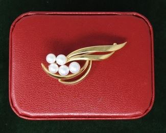 Jewelry 11: Mikimoto 18k Gold and Pearl Pin  $525
18k gold set Japanese Akoya Saltwater Cultured Pearl brooch holding one 6mm, two 5.75mm, and two 5.22mm sized pearls. The pearls are of good quality, white base color, slight rosé overtone and well matched. Brooch is 2” in length with all the pearls set on pegs at the base. 5.3dwt. Includes Mikimoto box.
