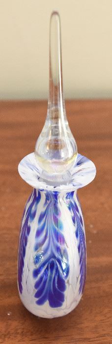 7. Iridescent Round perfume bottle with stopper and cobalt blue $30 “Feathers”. Unmarked on bottom. Hand blown. Top lip ground. No chips or cracks. 3.5” wide, 1” thick, 6.25” tall with stopper