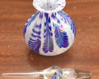 7. Iridescent Round perfume bottle with stopper and cobalt blue $30 “Feathers”. Unmarked on bottom. Hand blown. Top lip ground. No chips or cracks. 3.5” wide, 1” thick, 6.25” tall with stopper