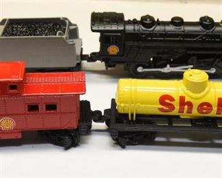 38. Four small Shell branded train cars $20