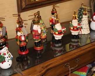 A dozen Christmas soap dispensers