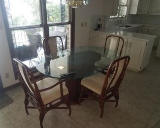 Nice rattan / glass top kitchen table.