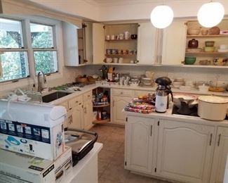Kitchen is overflowing with quality cookware and utensils.