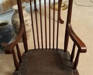 Antique childs leather seat rocker.  Have photo of child sitting in chair. 