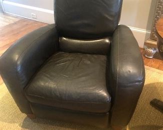 one of two Italian black leather recliner chairs. Great compact size and sleek design!