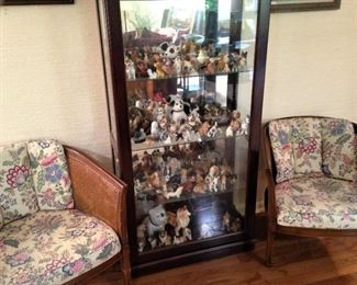 Curio cabinet of miniature dogs; matching cane side chairs