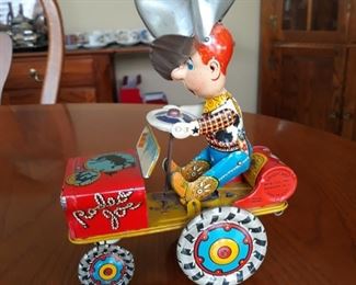 Vintage wind up tin toy