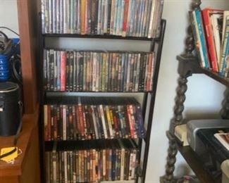 Lot 200- dvd movies $1 each DVD rack $15  We SOLD some but still have some left