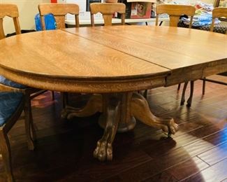 Large Antique Oak Table with heavy Cared Claw Foot Pedestal, with one leaf