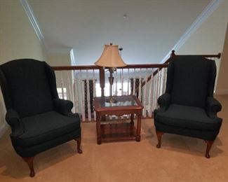 pair of green cloth chairs and side table w/ lamp