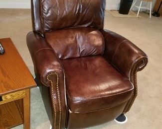 2 matching brown leather recliners and 2 matching burgundy leather recliners with footrests