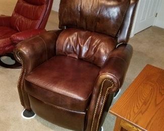 pair brown leather recliners