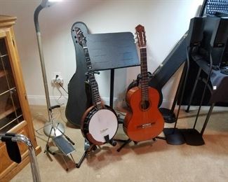 banjo, guitar with stands and music stand