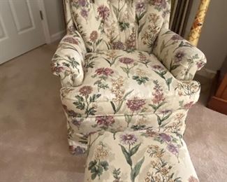 Upholstered chair with foot stool