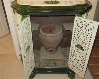 75% Off - Now $175    Was $695 Gorgeous 19th century Antique French Stove.  Enameled cast iron 
parlor stove with exceptional  detailing.    All four doors open for easy access.