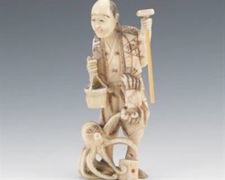 Japanese Carved Whale Tooth Okimono of Fisherman with Octopus and Crab 