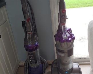 Two Dyson Vacuum Cleaners