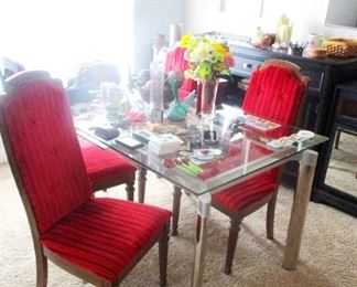 Glass & stainless dinning table with restored re upholstered antique chairs