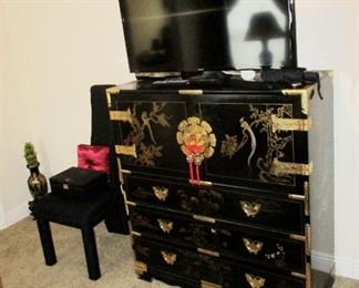 Chinese  black lacquer & brass chest of drawers.  New flat screen TV