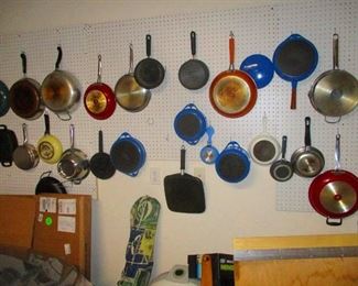 A few extra frying pans.  She cave in  garage.