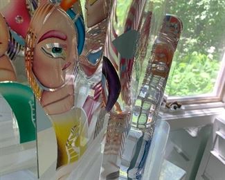 Yankel Ginzburg Acrylic Sculpture "Paradise" Signed and numbered.(numbered 23/45) and entitled "Paradise"
Magnificent movable five piece painted acrylic sculpture by world famous artist Yankel Ginzburg whose work is given by the government to foreign diplomats, collected by true art lovers. This piece has a male profile, a female profile, the lovers, with another piece representing Paradise, and the fourth the World. Moving the 4 pieces around in the slots in the base, changing their positions, is such a joy, giving deep meaning to the love of the two in Paradise.