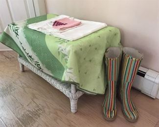 Small wicker table and garden boots.