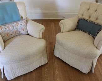 Pair of tufted arm chairs