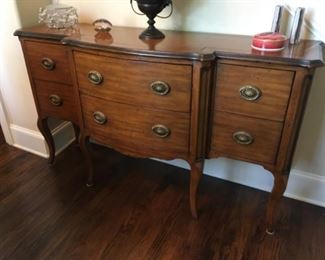 Item:   Theodore Alexander Buffet/Sideboard
Condition:   Excellent
Measurements: 60w x 18d x 35h
Description:  Contemporary French style with step back sides and cabriole legs

Price: $1,200
