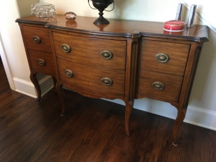 Item:   Theodore Alexander Buffet/Sideboard
Condition:   Excellent
Measurements: 60w x 18d x 35h
Description:  Contemporary French style with step back sides and cabriole legs

Price: $1,200
