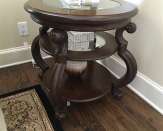 Item:   Round End Table by Longwealth Company
Condition: Excellent   
Measurements: 26d x 28h
Description:  Glass insert with 3 shelves 

Price:  $200
