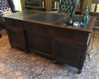 Item:   Thomasville Executive Desk with leather top
Condition:   Good
Measurements: 67w x 31d x 32h
Description:  Beautiful desk with flame mahogany, leather top.  About 10 years old.  Normal wear.  

Price:  $1,500

