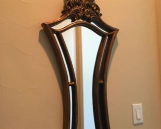 Item:   Gold Mirror with leaf top
Condition:  Excellent 
Measurements: 19w x 2d x 44h
Description:  Gold mirror made of plastic

Price: $65
