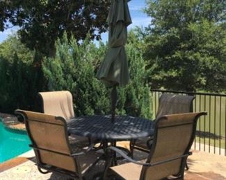 Item:   Patio Table with umbrella and 4 chairs
Condition:   Good +
Description:  2 rocker/swivel chairs and 2 armchairs with umbrella
Table measures 48d x 30h

Price:  $600
