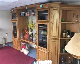 . . . this wall unit is spectacular and features plenty of nooks and cabinets to display your treasures