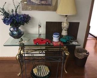 . . . a nice glass and brass table -- matches the end table pair