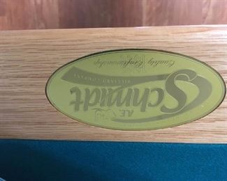 . . . the authenticity proof -- Schmidt label on pool table