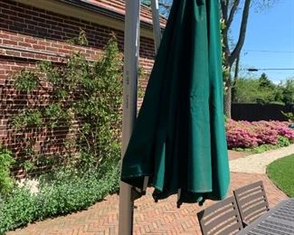 Sola large umbrella. Measures 9' tall. Base measures 4' in diameter. $100