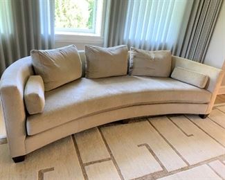 Curved Interior Crafts sofa with down filled cushions. MEASUREMENTS: 27 1/2"H x 96"L x 42"D. $1200.