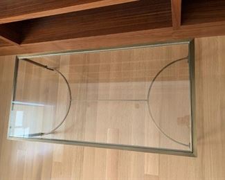 Baker bronze and glass coffee table. MEASUREMENTS: 17"H x 48"L x 24"D. $350