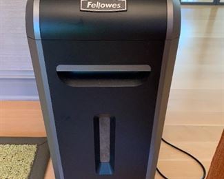 Paper shredder. MEASUREMENTS: 24 1/2"H x 9 1/2"W x 14"D. PRICE: $65