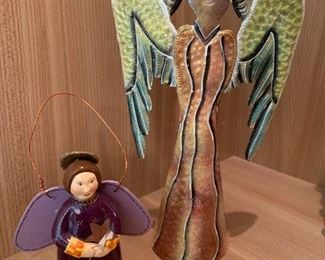 Pair of angel figurines. MEASUREMENTS: 12"H x 7"W. Smaller piece 5 1/4"H. $25