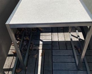 Pair of chrome and granite side tables. MEASUREMENTS: 19"H x 19" x 19". $225