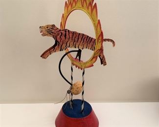 Tiger through ring of fire balancing sculpture. MEASUREMENTS: 16 1/2"H x 10"W. $75