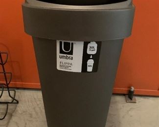 Trash can. MEASUREMENTS: 24"H x 14"D x 9 1/2"W $5