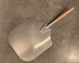 Metal pizza peel. MEASUREMENTS: 28"L x 14"W $5